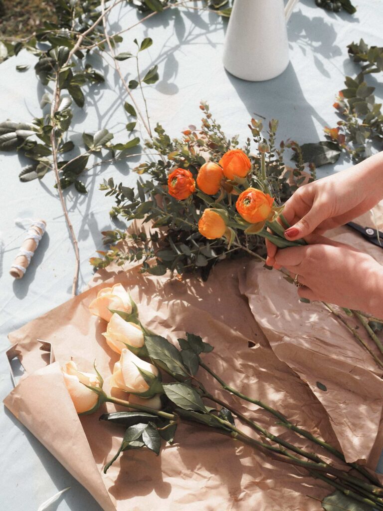 lady holding flowers in florists